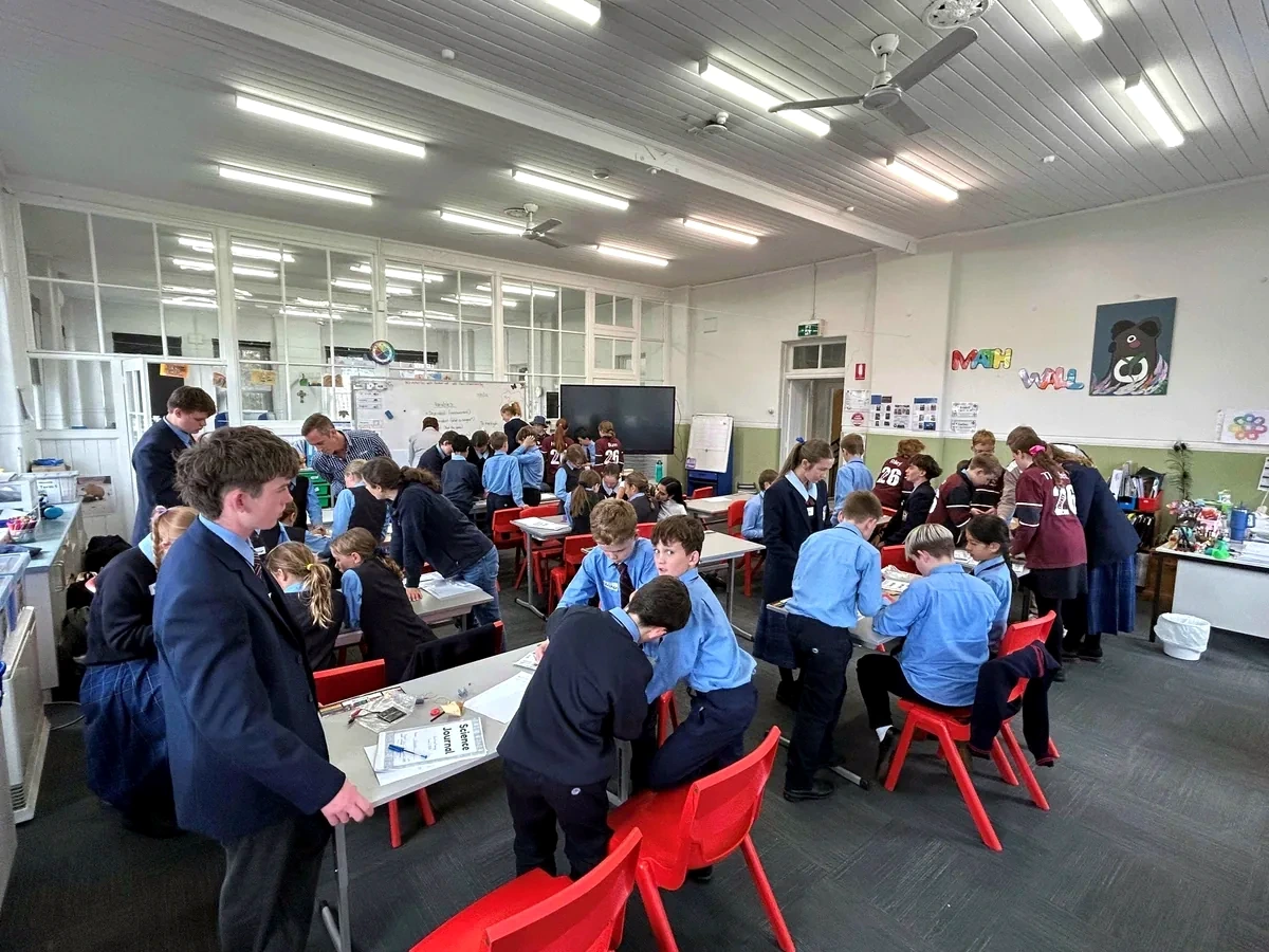 Year 9 and 10 MySTics supporting younger students during a classroom investigation